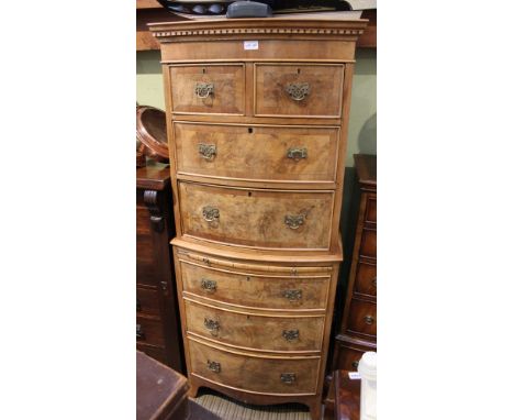 A good quality reproduction bowfront chest on chest unit having dental cornice over to in-line and to further fullwidth drawe