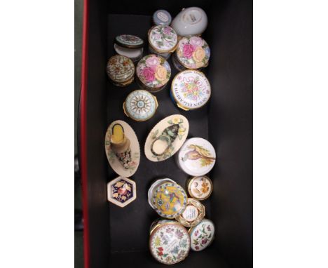 A box containing a large selection of collectable trinket boxes to include enamelled examples 