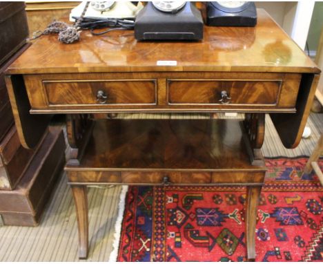 A good quality reproduction small sized sofa type table, with twin flap top, two in line drawers on pierced lyre shaped uprig