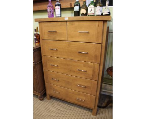 A modernist light would bedroom chest, having two in-line drawers over four further full width drawers 