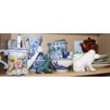 A blue and white toilet jug and basin, a pair of planters, on stands, a floral decorated watering