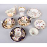 An 18th century English porcelain tea bowl, decorated insects and flowers, a Ridgeway jug with