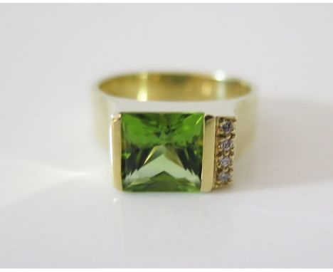 A 14K Gold, Peridot and Diamond Ring, size O, 7.4 g