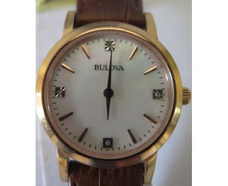 A Bulova Ladies Gold Plated Wristwatch with mother of pearl dial, boxed