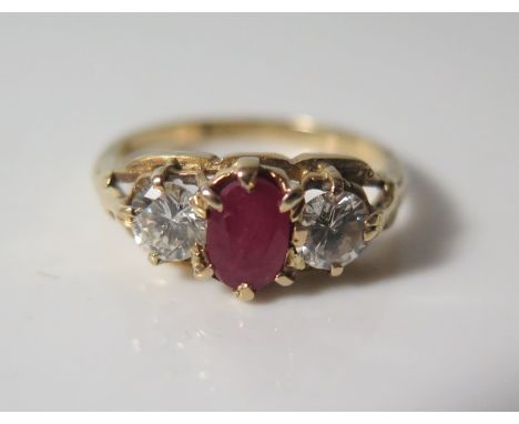 An 18ct Gold, Ruby and Diamond Three Stone Ring, size L, 3.2 g