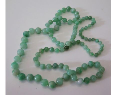 A Graduated Jade Bead Necklace, largest c. 10 mm, c. 82 cm long, 59 g