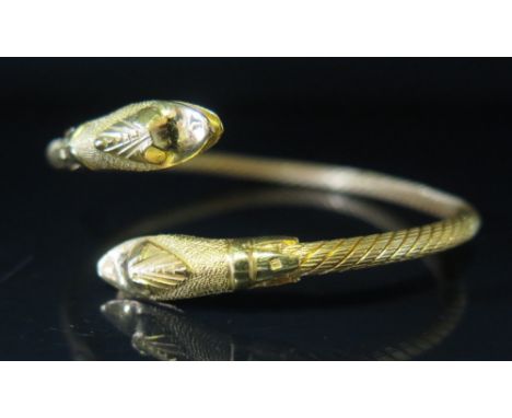 An Egyptian 21ct Gold Torque Bangle with serpent head finials, 35.7 g