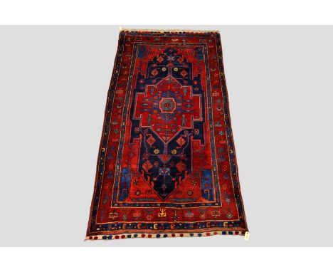 Kolyai Kurd carpet, north west Persia, late 20th century, 9ft. 1in. x 4ft. 4in. 2.77m. x 1.32m. Note the piled tufts to the g