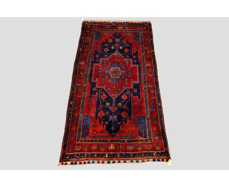 Kolyai Kurd carpet, north west Persia, late 20th century, 9ft. 1in. x 4ft. 4in. 2.77m. x 1.32m. Note the piled tufts to the g