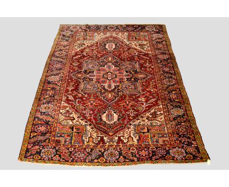 Heriz carpet, north west Persia, circa 1930s, 10ft. 11in. x 8ft. 3.33m. x 2.44m. Slight losses to ends. 