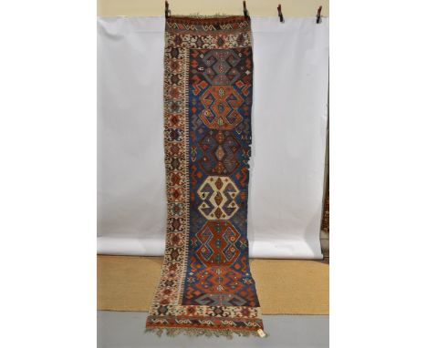 Konya half kelim, central Anatolia, first half 19th century, 12ft. 5in. x 3ft. 2in. 3.78m. x 0.97m. Holes in places and ‘bite