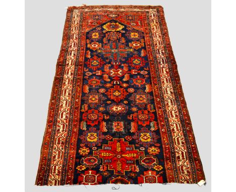 Saraband kelleh fragment, north west Persia, late 19th/early 20th century, 10ft. 4in. x 5ft. 5in. 3.15m. x 1.65m. Dated twice