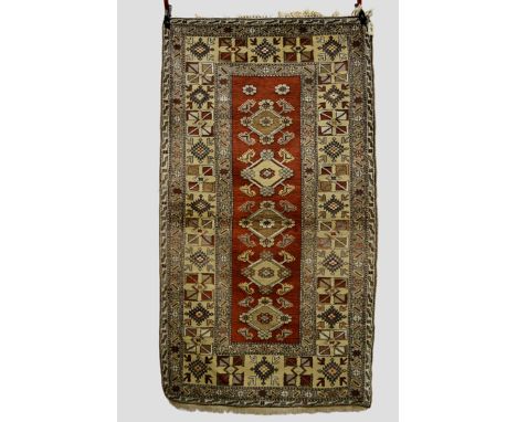 Two Melas rugs, west Anatolia, both modern, the first with narrow chestnut field with a single row of medallions with wide be