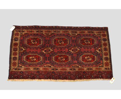 Three Tekke Turkmen 3 x 2 turreted gul chuval faces, Turkmenistan, early 20th century, the first 2ft. 5in. x 4ft. 10in. 0.74m