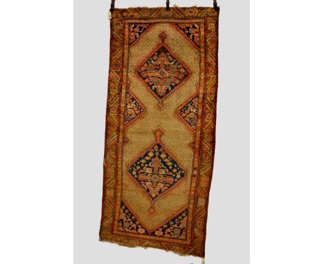 Sarab long rug, north west Persia, circa 1930s, 8ft. 2in. x 3ft. 9in. 2.49m. x 1.14m. Overall wear; some repairs and losses t