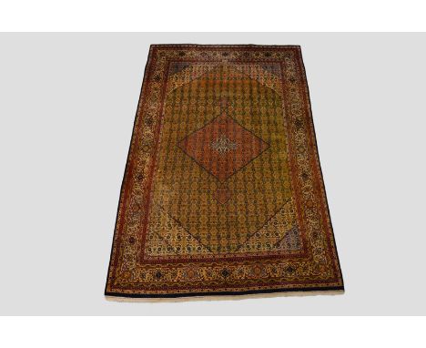 Tabriz signed carpet, north west Persia, mid-20th century, 9ft. 10in. x 6ft. 4in. 3m. x 1.93m. Note the signature cartouche i