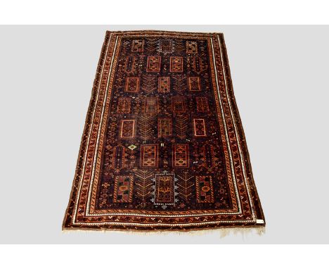 Good Baluchi part silk carpet, Khorasan, north east Persia, circa 1920s-30s, 11ft. x 6ft. 5in. 3.35m. x 1.96m. Areas of wear 