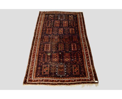 Good Baluchi part silk carpet, Khorasan, north east Persia, circa 1920s-30s, 11ft. x 6ft. 5in. 3.35m. x 1.96m. Areas of wear 