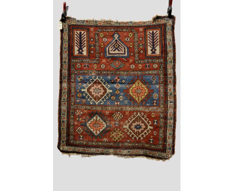 Two Kuba prayer rugs, north east Caucasus, early 20th century, the first, with a blue and red banded mihrab, 4ft. 1in. x 3ft.
