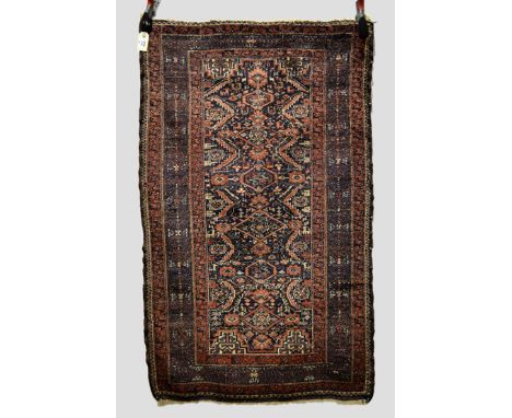 Salar Khani Baluchi rug, Khorasan, north east Persia, circa 1930s, 4ft. 7in. x 2ft. 9in. 1.40m. x 0.84m. Slight wear and moth