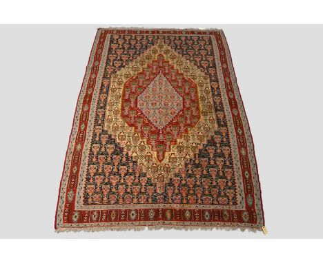 Senneh ghileem carpet, north west Persia, second half 20th century, 9ft. 11in. x 6ft. 7in. 3.02m. x 2.01m. Some surface marks