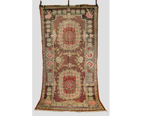 Khotan double medallion rug, Xinjiang, east Turkestan, first half 20th century, 10ft. 6in. x 5ft. 6in. 3.20m. x 1.68m. Overal