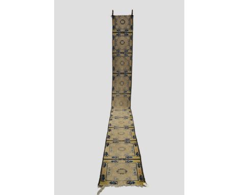 Ninxia meditation runner of ten panel design, north west China, possibly first quarter 19th century, 19ft. 3in. x 2ft. 5.87m.
