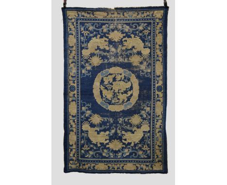 Ninxia fo-dog rug, north west China, probably first half 19th century, 7ft. x 4ft. 5in. 2.13m. x 1.35m. Overall wear, heavy i