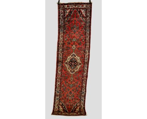 Two Hamadan runners, north west Persia circa 1930s-1940s, the first: 9ft. 10in. x 2ft. 9in. 3m. x 0.84m. Some wear and moth d
