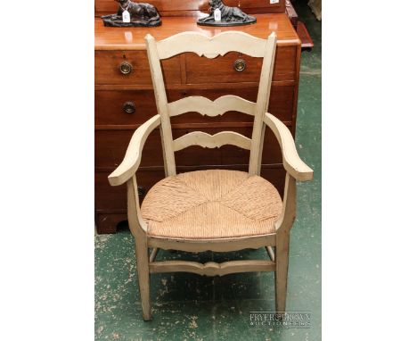 A painted carver chair with rush seat