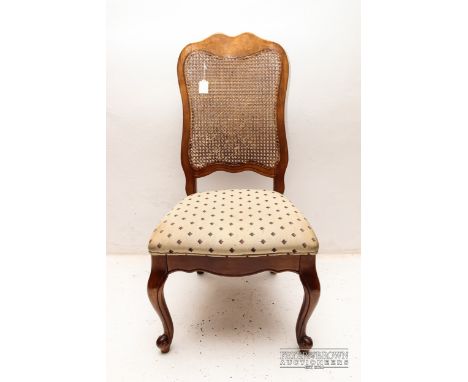 An oak hall chair with rattan back and upholstered seat, cabriole front legs