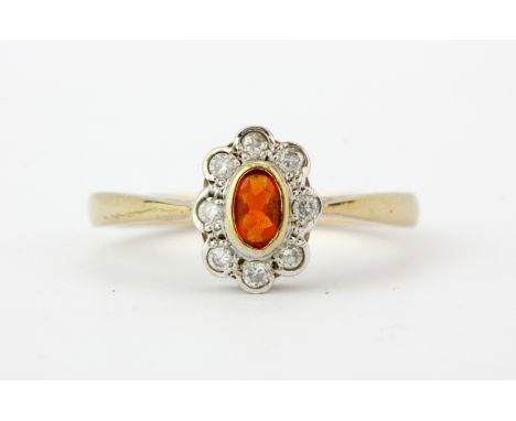 A 9ct yellow gold fire opal and diamond set cluster ring, (N).