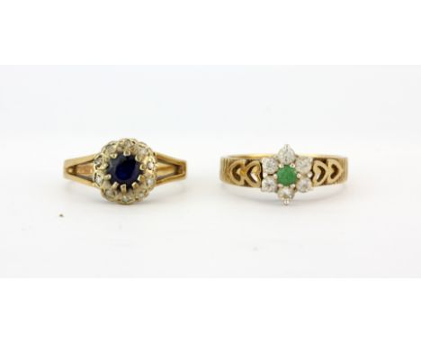 A 9ct yellow gold sapphire and diamond set cluster ring, together with a 9ct gold emerald and white stone set ring, (K.5 &amp