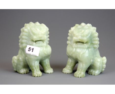 A pair of Chinese carved jade / hardstone figures of lions, H. 13.