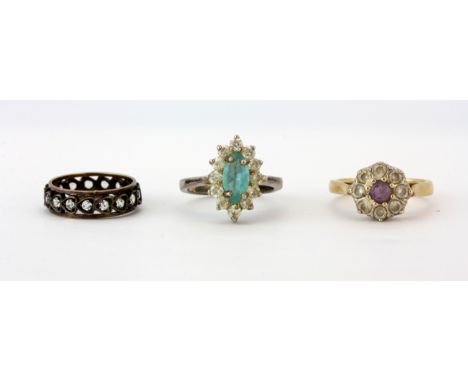 A 9ct yellow gold stone set cluster ring, a 925 silver stone set cluster ring and a gold and silver stone set full eternity r