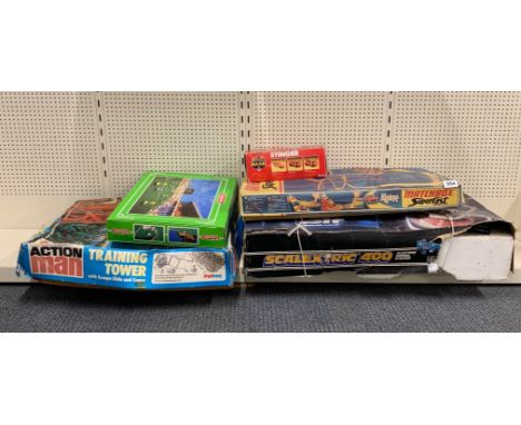 A boxed Scalextric 400 racing set together with a Matchbox Superfast track set, Action Man, training tower and other items.