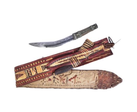 An original Southern Arabia shafra / matwa dagger. Wooden grip with fine filigree bands and a curved blade with a single full