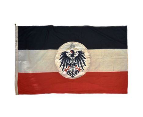 A WWI First World War Imperial German / Prussian Empire Colonial flag. Black, white and red tri-colour flat with a silk disc 