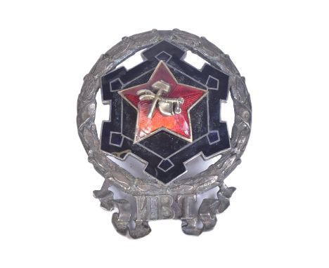 An early Russian Soviet Union Red Guards Commander badge. Silver with back and red enamel and a central hammer and sickle. Sc