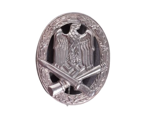 A WWII Second World War Third Reich Nazi German General Assault badge. The badge being a solid back example with oak leaf bor