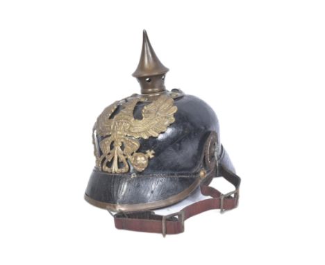 A WWI First World War Imperial German Army / Prussian M15 pickelhaube uniform helmet. Leather construction with brass front p