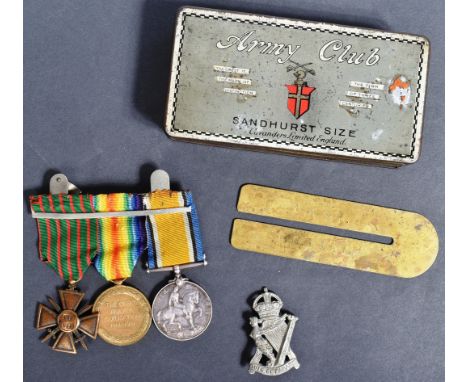 A WWI First World War medal trio awarded to one 7201 Pte F. C. Stay of the Royal Irish Rifles along with his cap badge and br