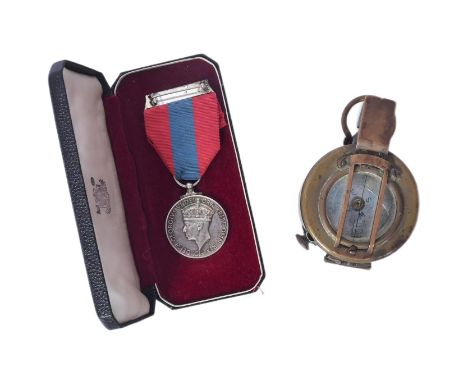 A WWII Second World War era Imperial Service medal awarded to one Henry Beech along with a Military issue MK1 Mils Prismatic 