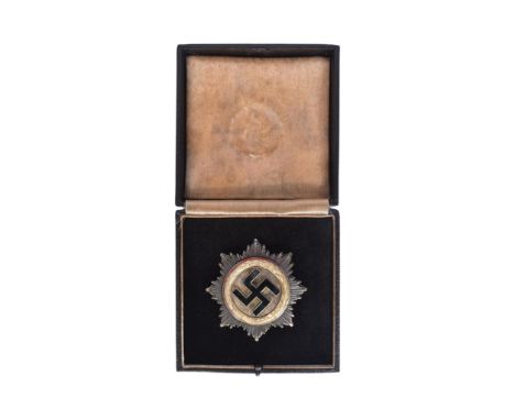 A replica WWII Second World War Third Reich Nazi German ' Deutsches Kruez ' ( The German Cross ) medal. The German Cross bein