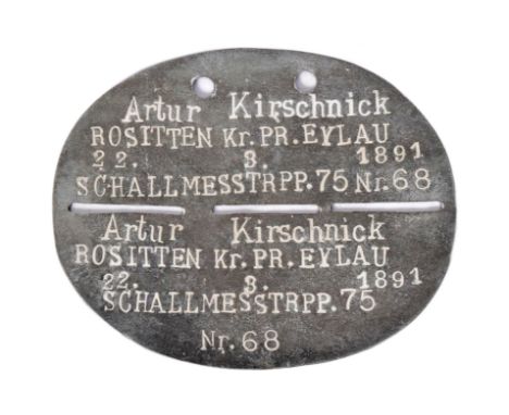 A WWI First World War Imperial German / Prussian Army soldiers dog tag. Oval shape with Top and bottom portion in tact.  Note
