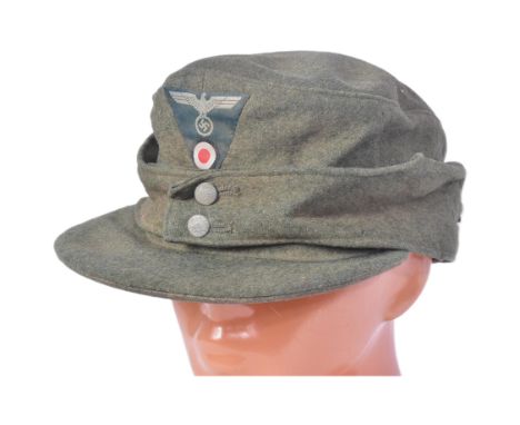 A WWII Second World War Third Reich Nazi German M43 cap with Light Infantry Mountain Troops insignia. Field grey / khaki wool