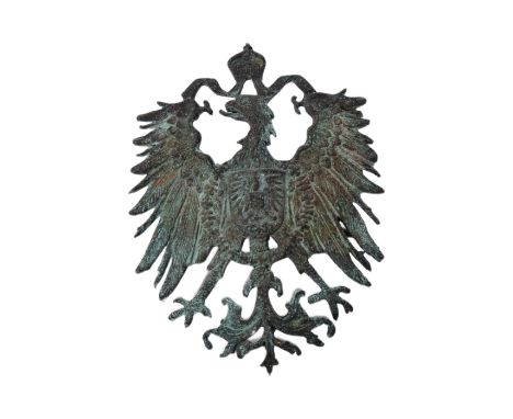 A WWI First World War Imperial German Colonial hat badge depicting the&nbsp;Prussian heraldic eagle topped with a crown. Two 