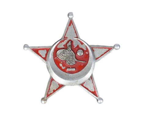 An original WWI First World War Turkish / Ottoman Empire Gallipoli Star medal. Star shaped badge with a the remains of a red 