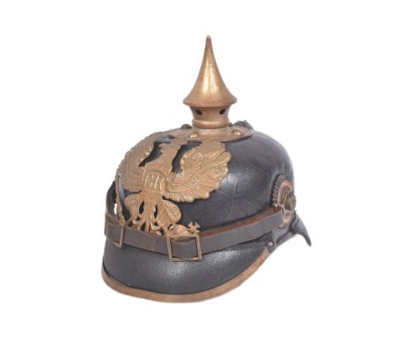 A WWI First World War Imperial German Army / Prussian 1895 model pickelhaube uniform helmet. Leather construction with brass 