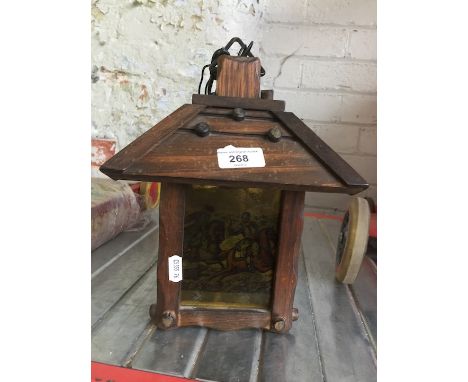 A wooden light fitting with hunting scene on glass 
